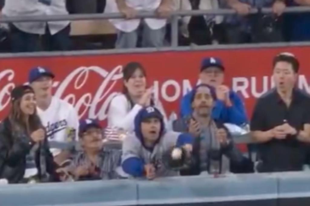 Fan interferes with deep Yankees fly ball in World Series controversy