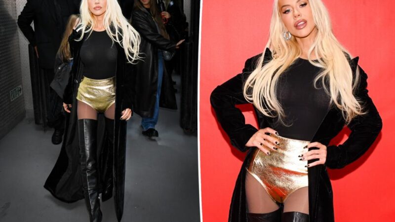 Christina Aguilera glows in gold hot pants and thigh-high boots