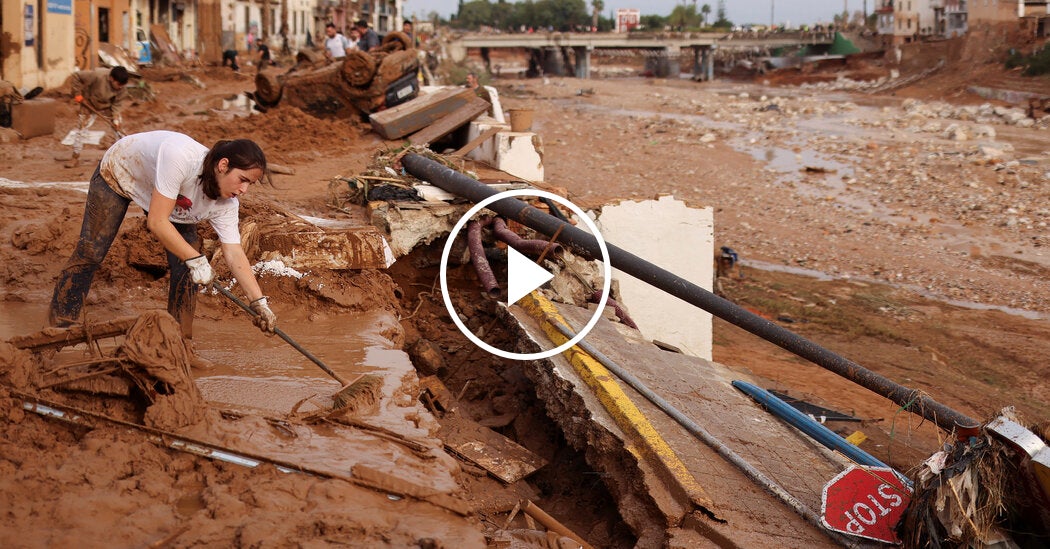 Volunteers Clean Up Debris After Unprecedented Flooding in Spain