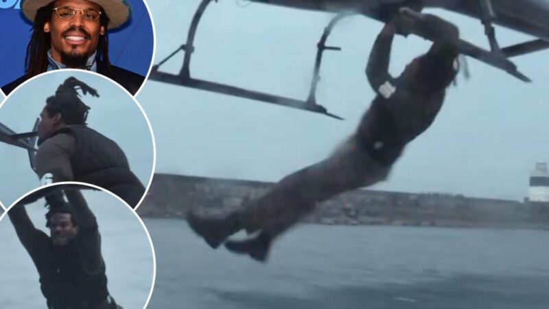 Cam Newton jumps onto helicopter from boat in reality show stunt