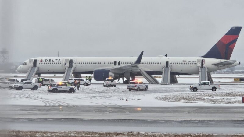 Delta passengers evacuate flight on emergency slides during aborted takeoff