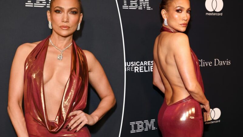 Jennifer Lopez shows off curves in skin-tight plunging halter gown at pre-Grammy party