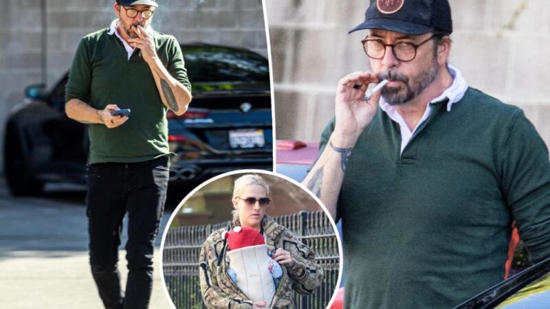 Dave Grohl puffs on a cigarette, appears stressed after mother of his secret love child is revealed