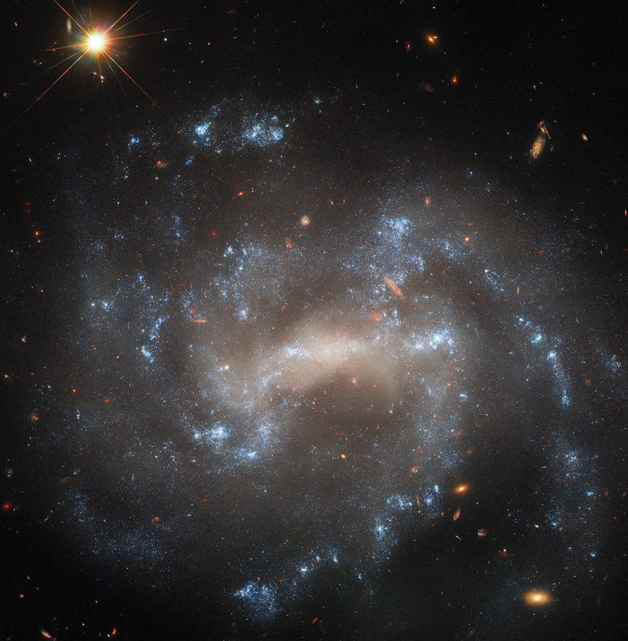 Hubble Spies a Spiral That May Be Hiding an Imposter