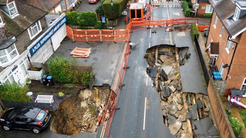 Large Holes Open Up in Surrey, England; Car Teeters on the Edge