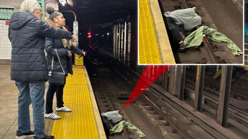 NYC straphangers flag down help for incoherent man lying on tracks — moments before incoming train was due to arrive